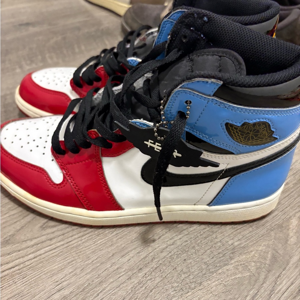 Nike Air Jordan 1 Retro High Fearless UNC Chicago sneakers.